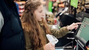 Little Girl at Self Service Checkout